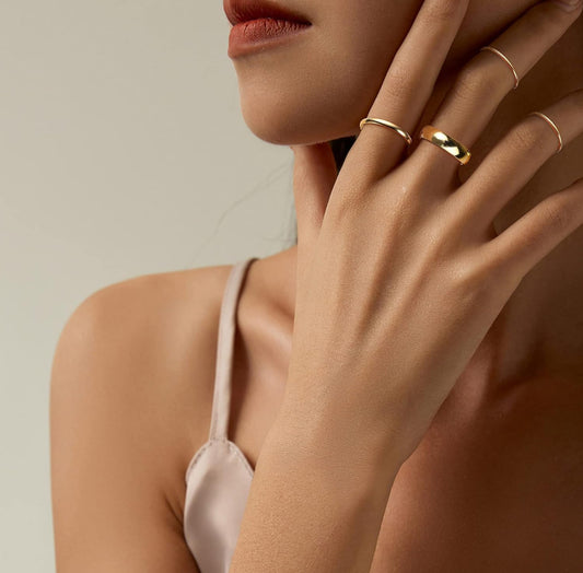 stainless steel gold filled rings stacked on hands