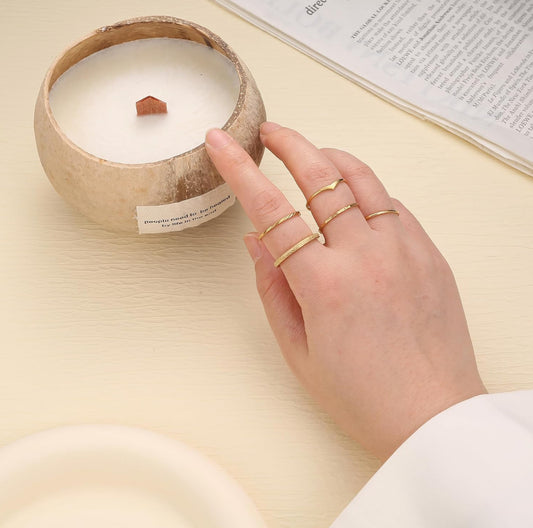 hand with stacked stainless steel rings