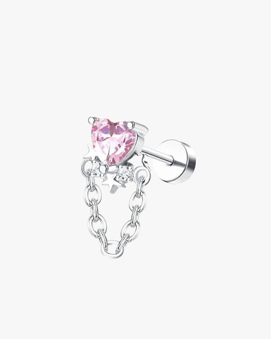 Silver earring with pink heart-shaped gemstone on a white background
