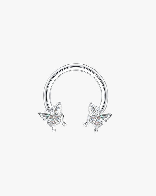 Silver circular earring with butterfly designs on a white background