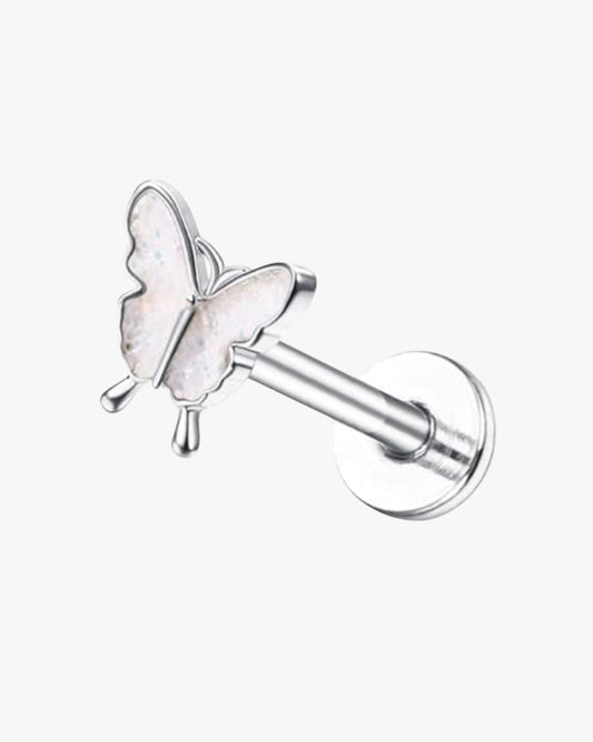 A silver-colored stainless steel stud earring with a butterfly design, intended for body piercing.