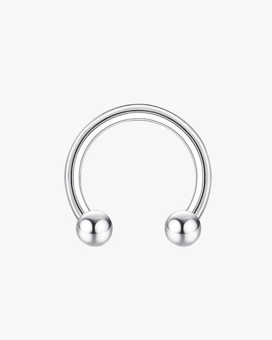 A gold-colored hoop with two spherical ends, likely made of stainless steel.