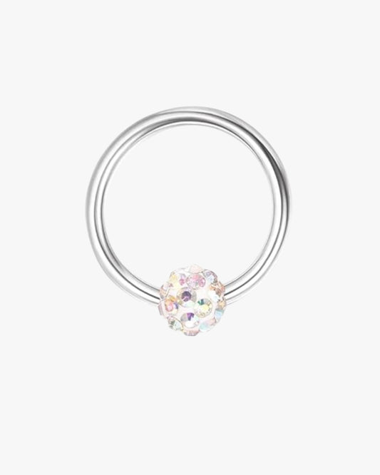 A silver-colored hoop earring with a multicolored gemstone in the center.