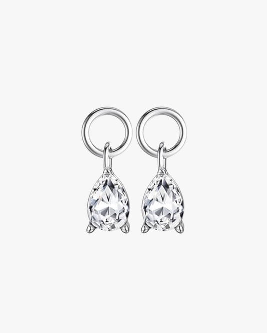 A pair of sterling silver hoop earrings with gold plating and a clear, faceted pendant attachment.