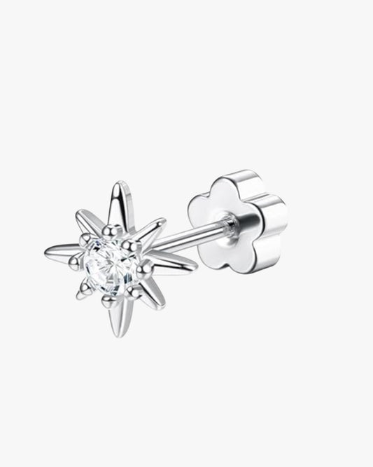 A double-headed stud earring with a star-shaped design, featuring a central cubic zirconia surrounded by smaller clear crystals, in a gold-tone setting.