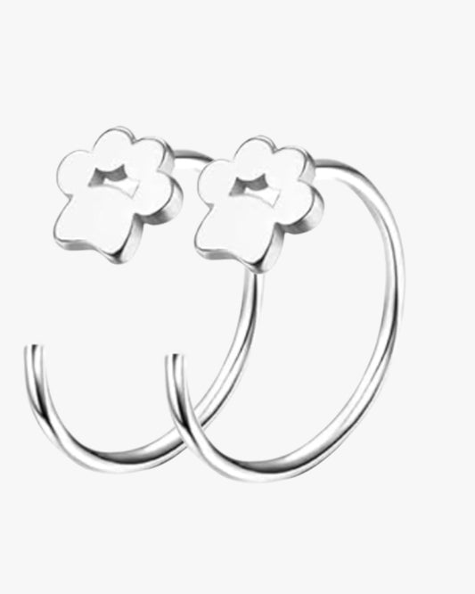 A pair of silver-colored stainless steel earrings designed as flower-shaped hoop earrings.