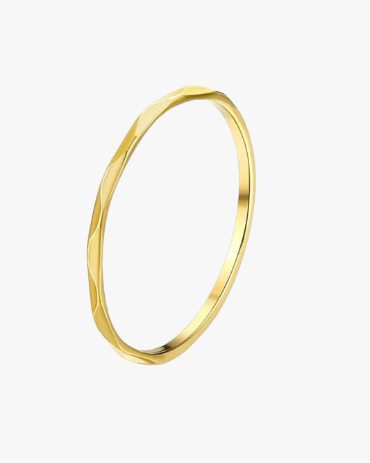 A gold-plated, solid gold ring with a minimalist design