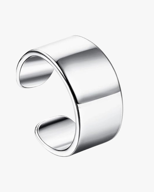 A gold-plated cuffwith a shiny finish and a loop fastening.