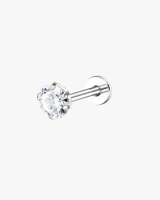 A single sil ver-colored stainless steel nose stud with a white zirconia gem.