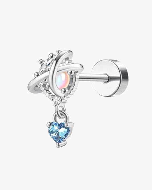 A silver-colored stainless steel stud earring with a blue and clear embellished centerpiece.