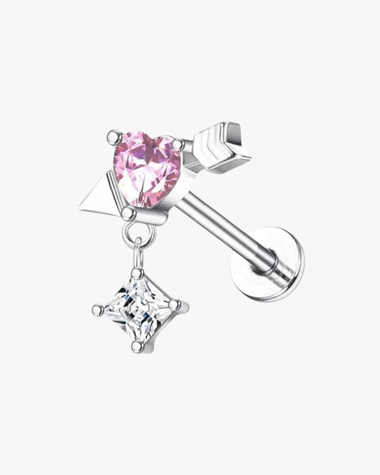 A single silver-colored stud earring with a pink heart gemstone.