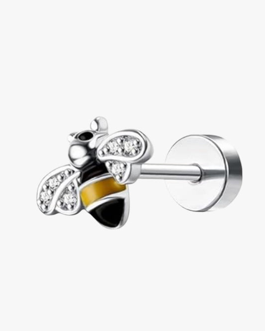 A single silver-colored stainless steel stud earring with a white zirconia gemstone in a vise-like mechanism.