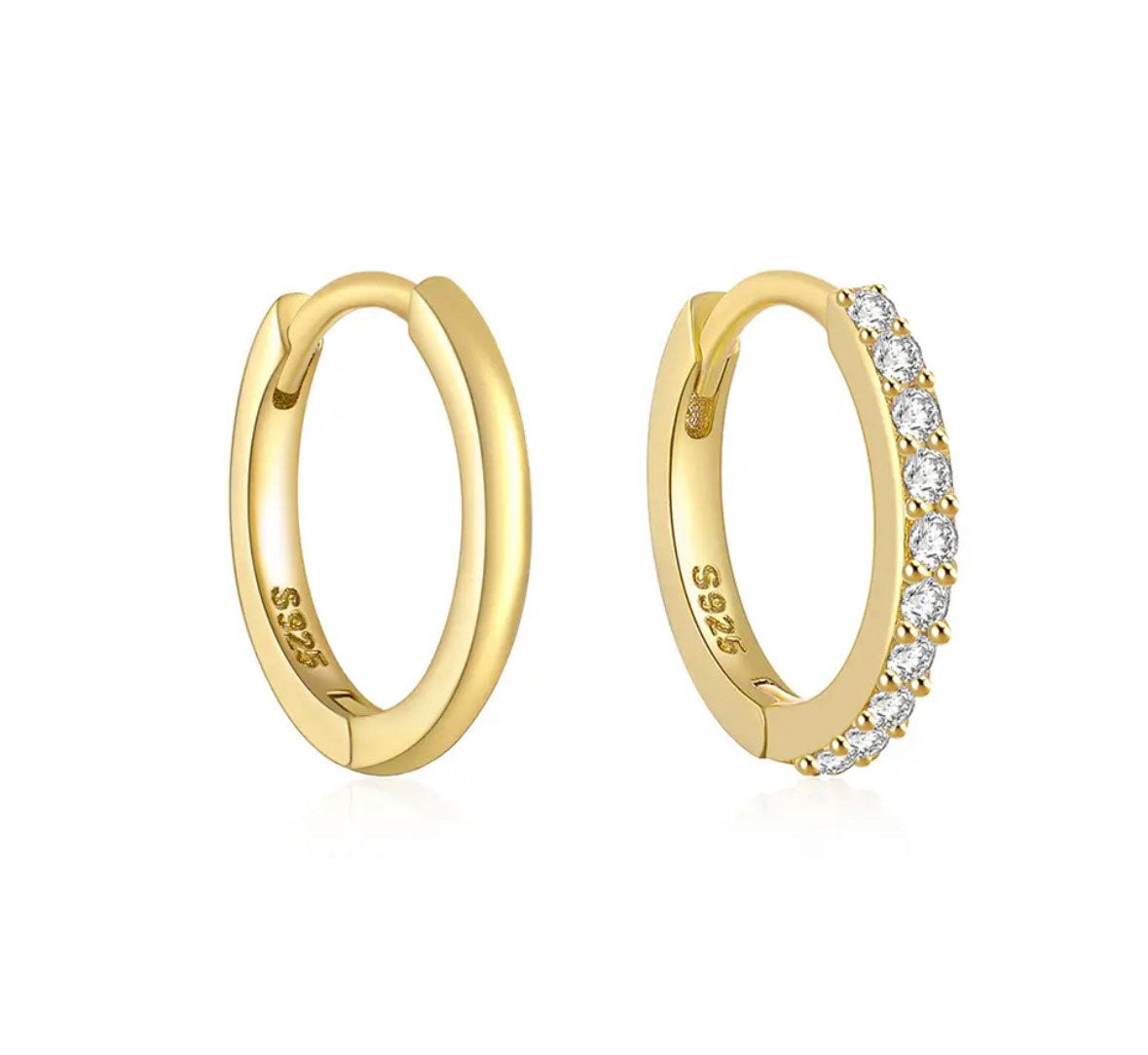 Image featuring stylish hoop earrings against a neutral backdrop. Perfect for adding a touch of sophistication to any outfit, these hoops exude timeless elegance and versatility. Elevate your look with these classic accessories, suitable for any occasion.