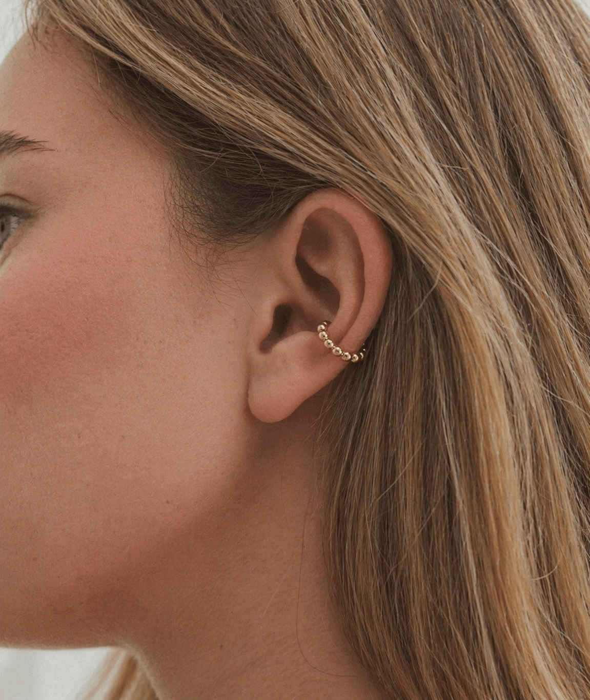 18K PVD Gold Beaded Ear Cuff on a model 