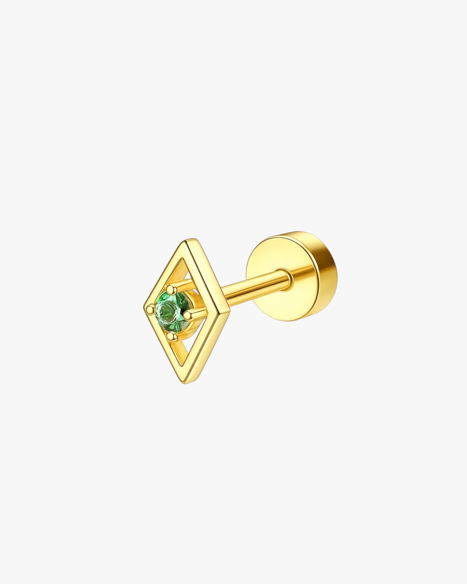 Gold stud earring with a green gemstone on a white background
