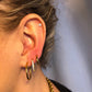 square stud in ear