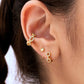 Sleek stainless steel huggie hoops for sensitive ears — timeless design. in ear