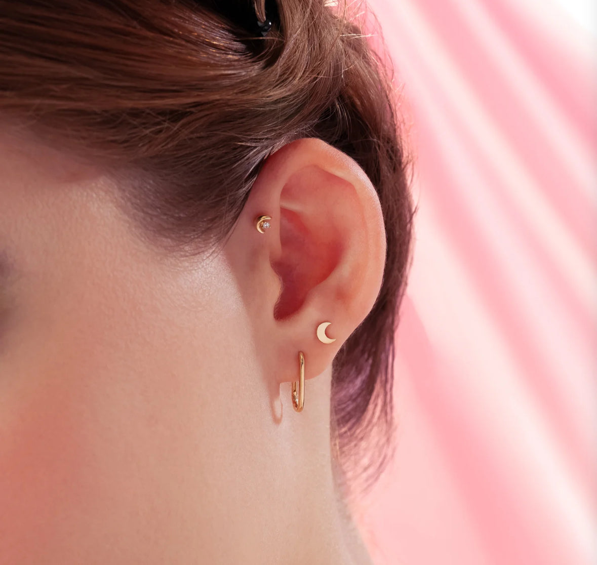 gold stud in ear moon shapped