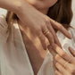 gold filled stainless steel earrings stacked on fingers