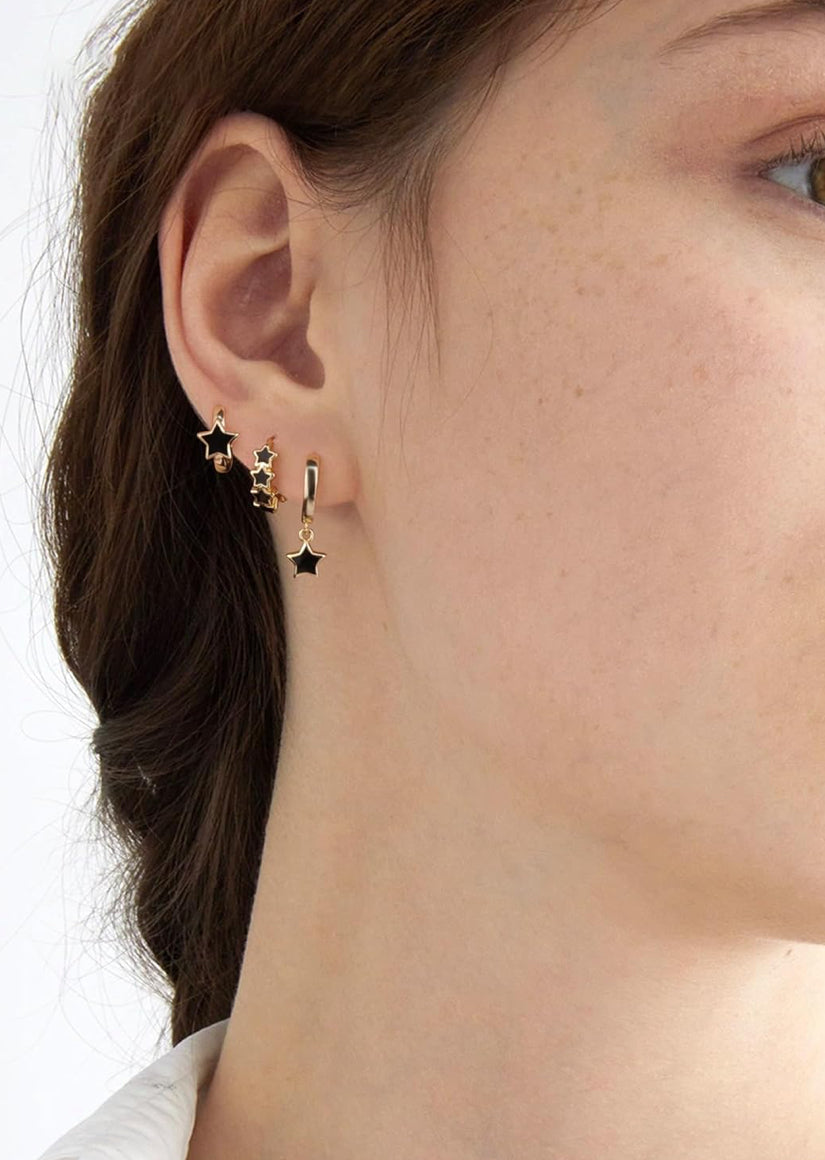 Gold-tone stainless steel hoops with smooth finish in ear