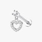 A single silver-colored stud earring with a heart-shaped setting featuring a central diamond, surrounded by smaller clear crystals.