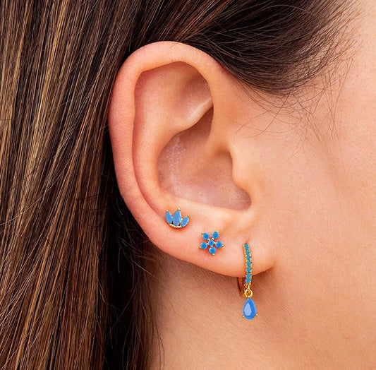 blue studs in ear
