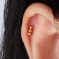 Gold stainless steel stud earring, hypoallergenic, minimalist design on ear