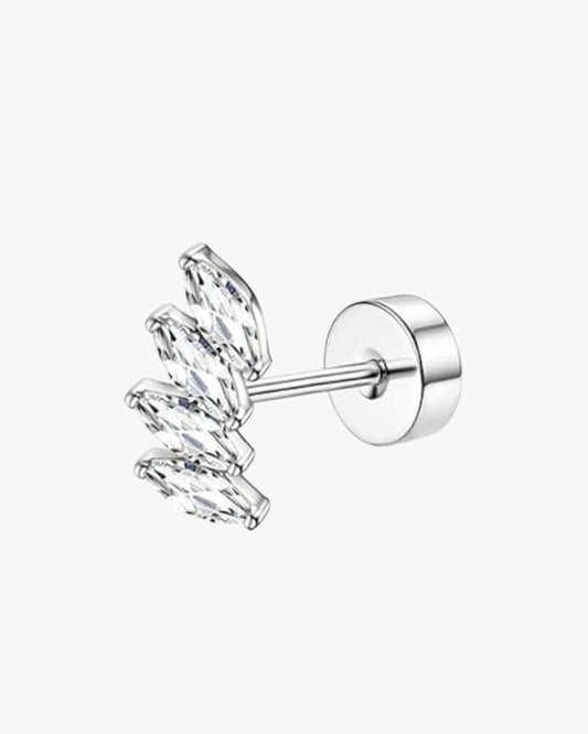 Silver earring with clear gemstones on a white background