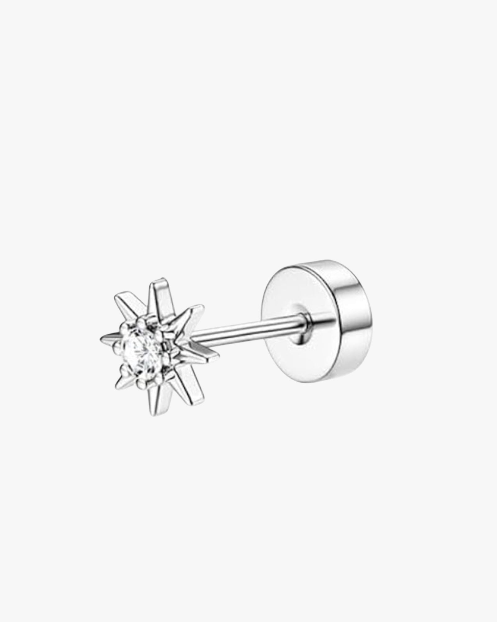 Silver earring with star-shaped design on a white background