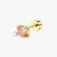 Gold earring with pink gemstone and star design on a white background