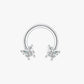 Silver circular earring with butterfly designs on a white background
