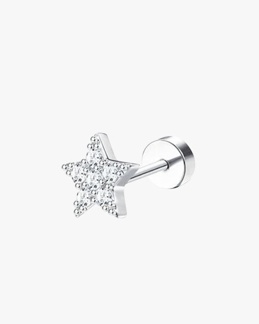 Star-shaped earring with clear stones on a white background