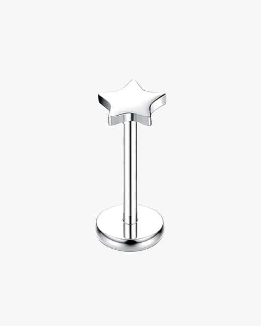 Silver star-shaped earring on a white background