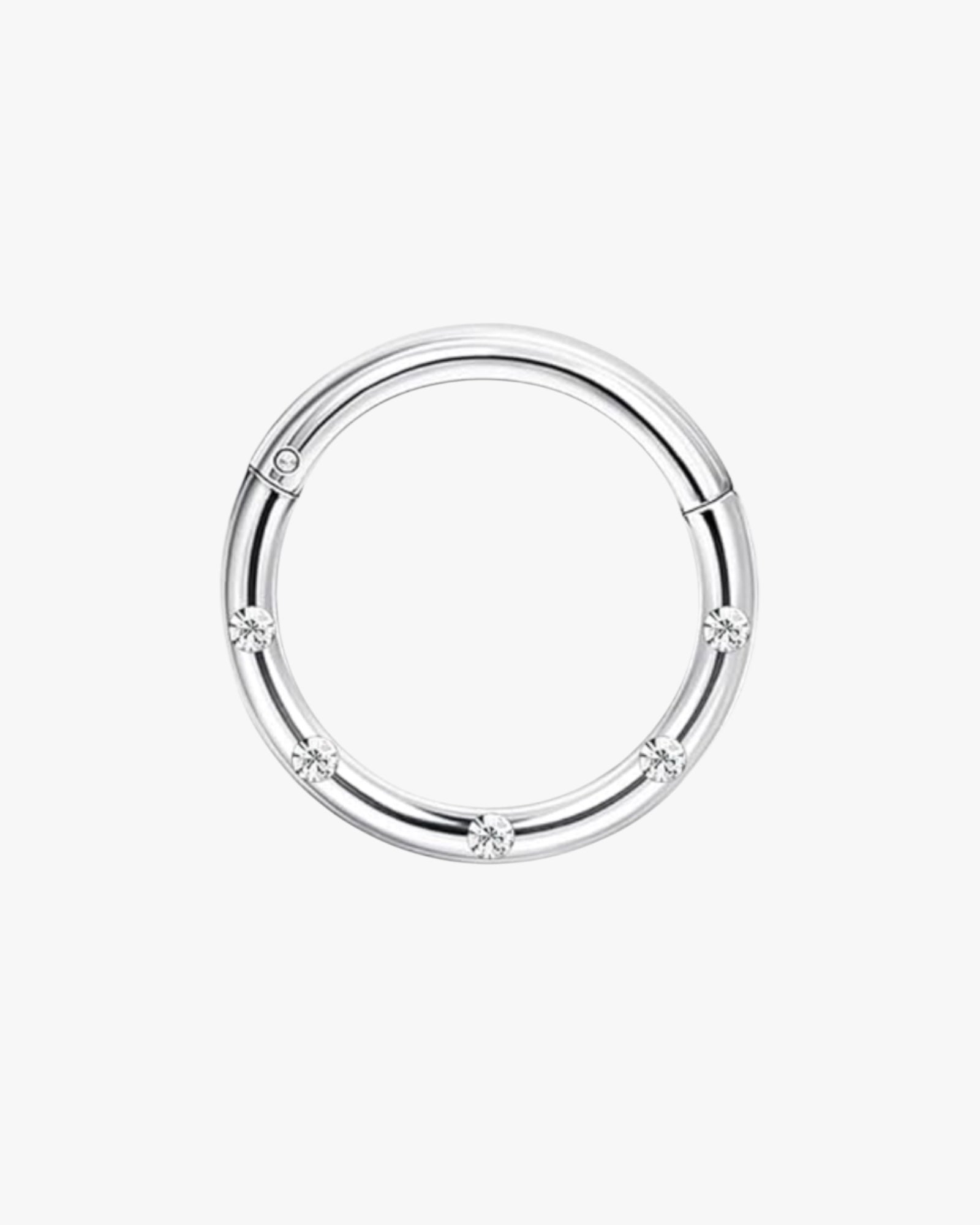 A gold-colored stainless steel hoop earring with a closed circular design and a small diamond-like embellishment in the center.