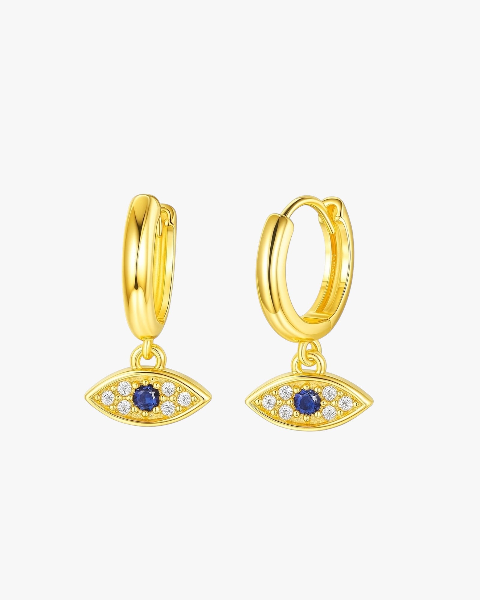 Gold hoop earrings with eye-shaped charms on a white background