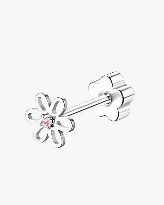 Silver flower-shaped earring with a pink gemstone on a white background