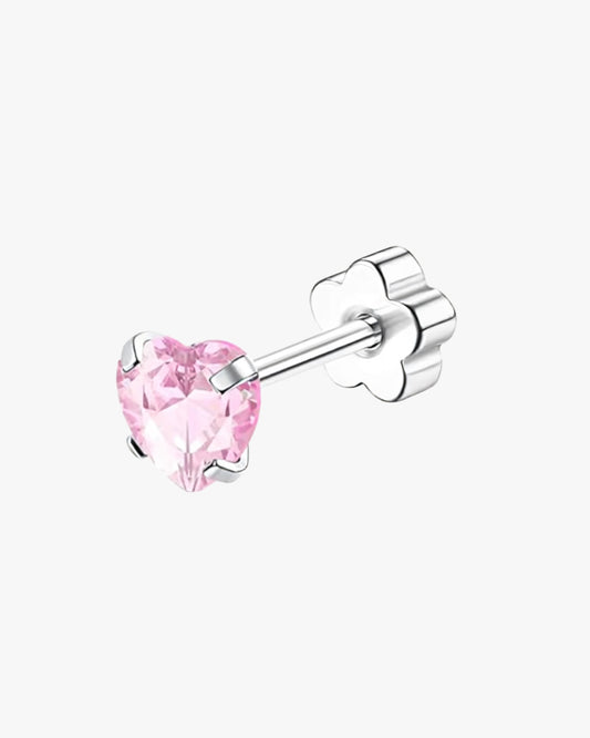 Pink heart-shaped stud earring on a white background