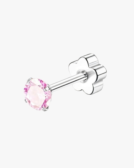 Silver stud earring with a pink gemstone on a white background