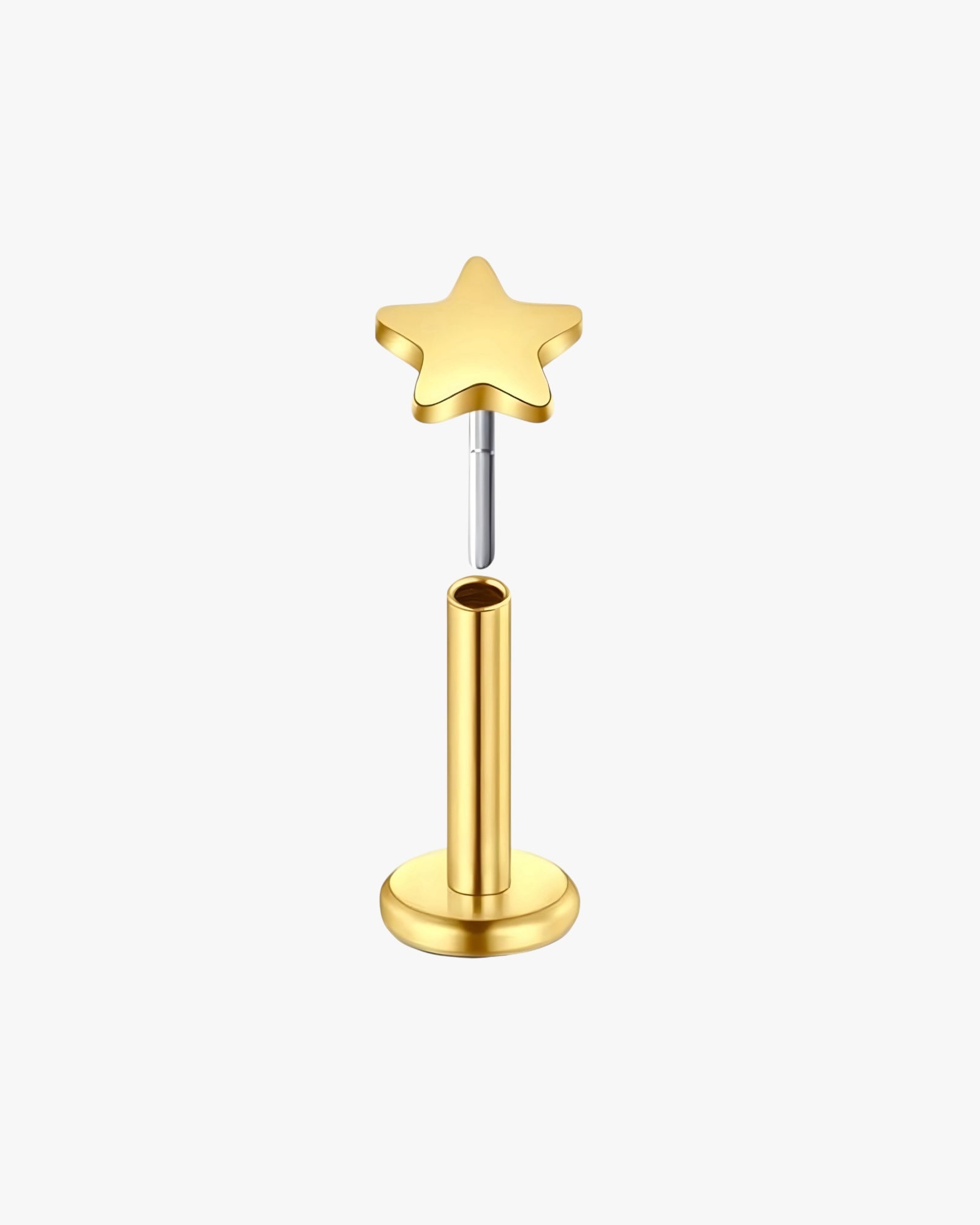 Gold star-shaped earring on a white background