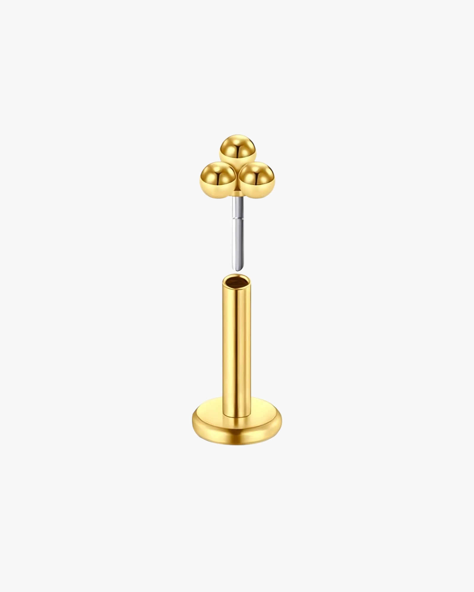 Gold-colored metal stand with spherical components on a white background