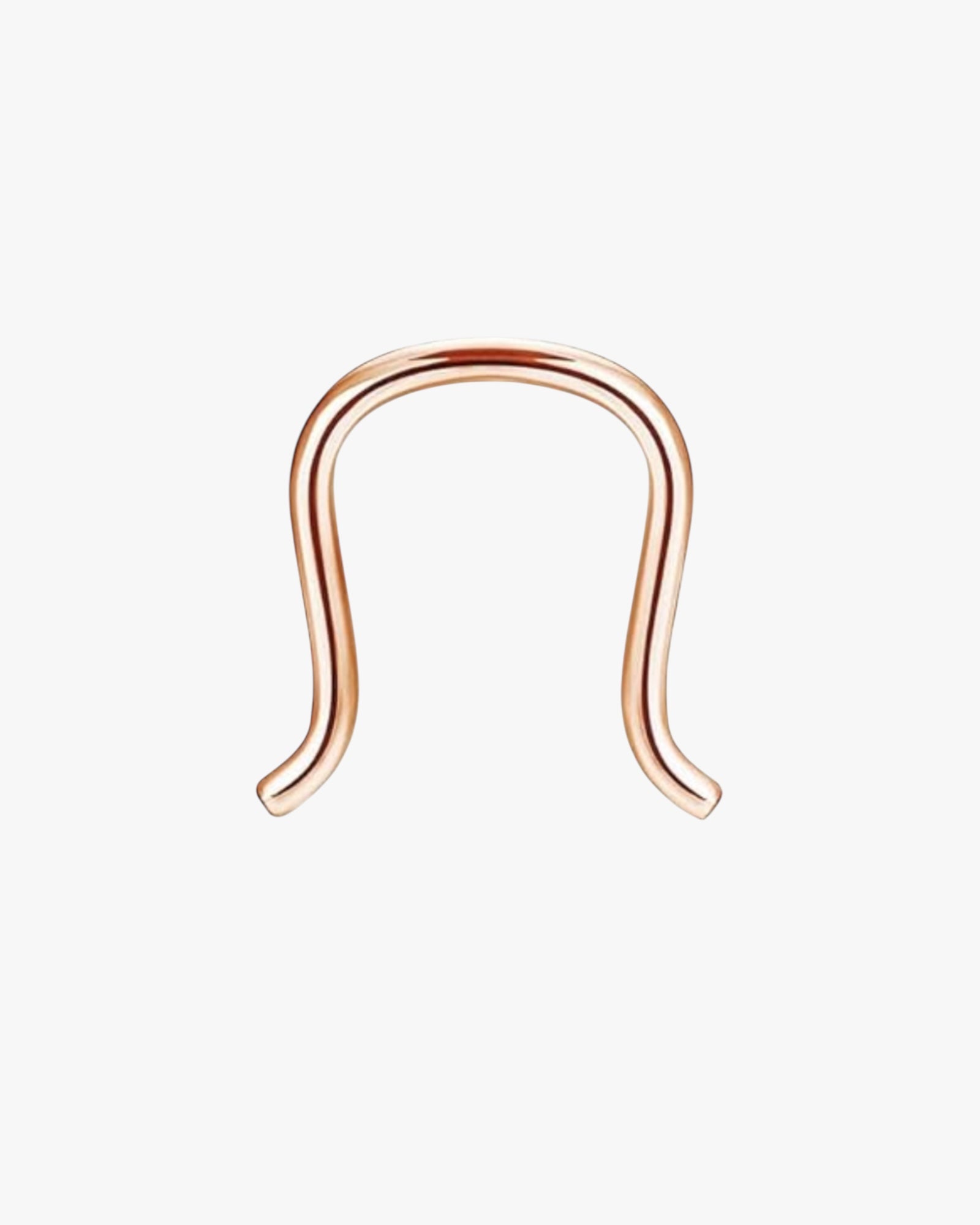 A rose  gold-colored stainless steel septum piercing ring.