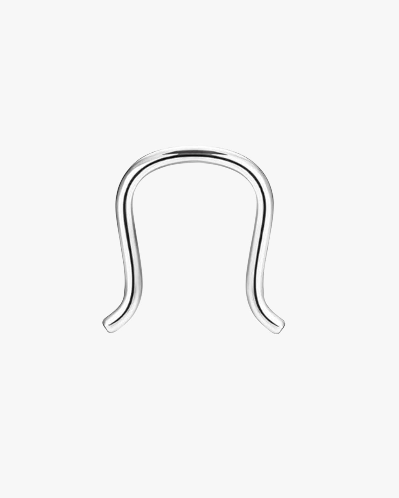 A silver-colored stainless steel septum piercing ring.
