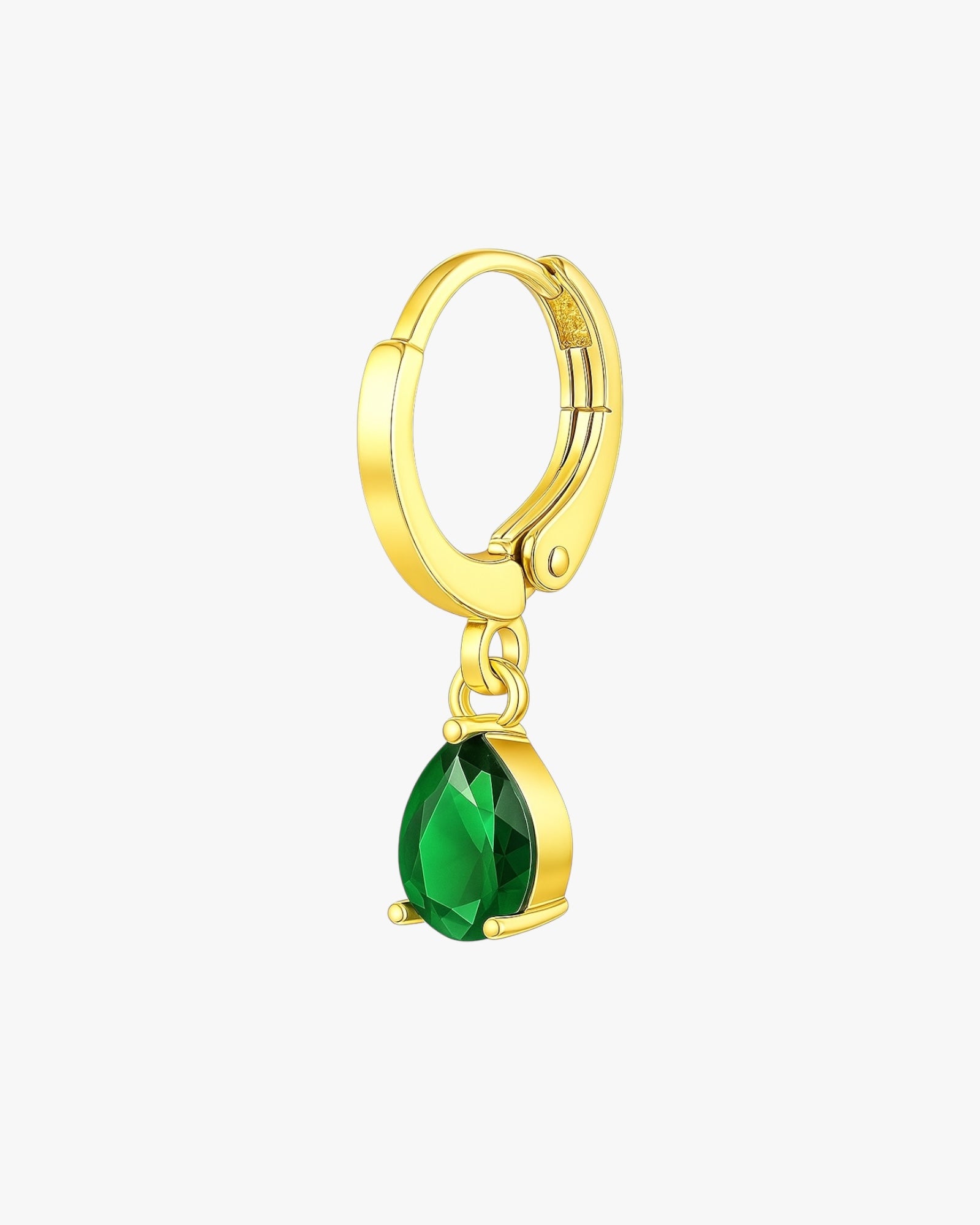 Gold hoop earring with a green gemstone on a white background