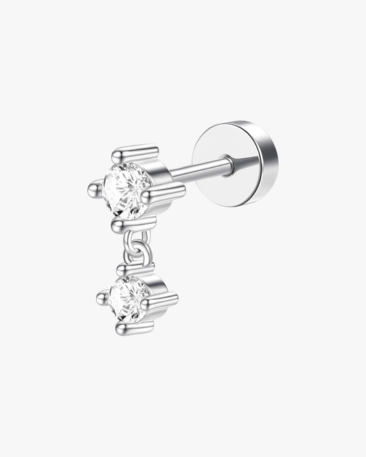 Silver stud earring with clear gemstones on a white background