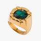 Gold stainless steel gold plated PVD 18K ring with a green gemstone on a white background