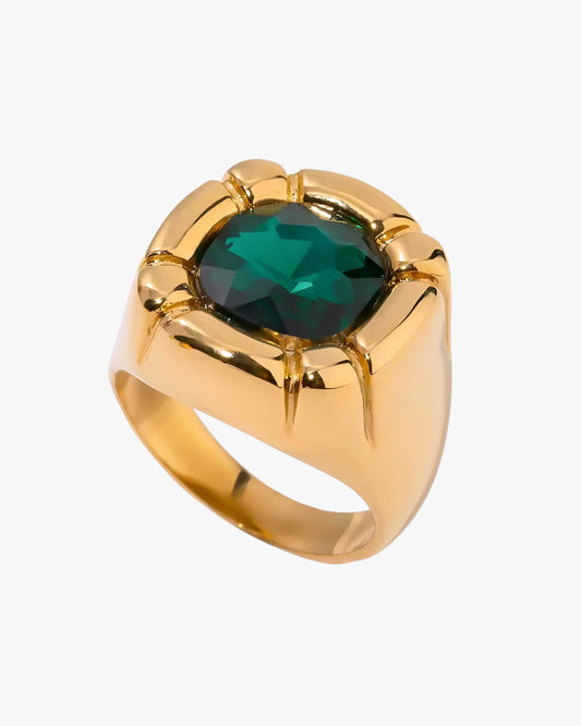 Gold stainless steel gold plated PVD 18K ring with a green gemstone on a white background