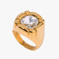 Gold stainless steel gold plated 18K PVD PLATED ring with a clear gemstone on a white background