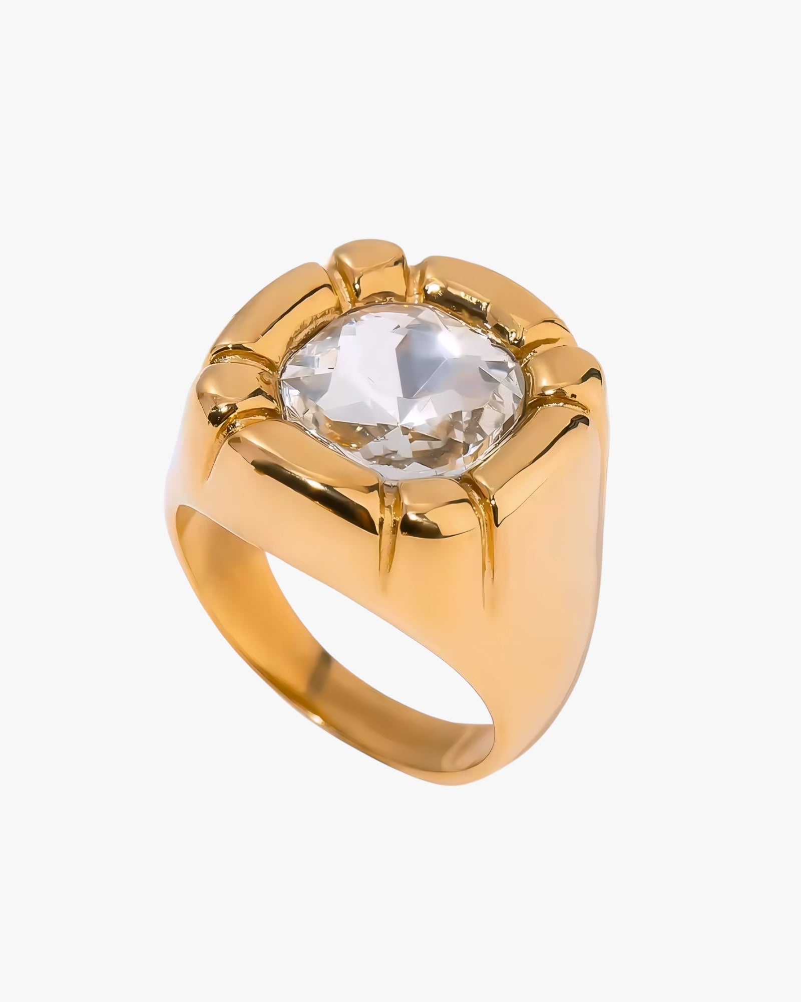 Gold stainless steel gold plated 18K PVD PLATED ring with a clear gemstone on a white background