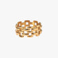 Gold stainless steel PVD 18K gold plated ring with a geometric design on a white background