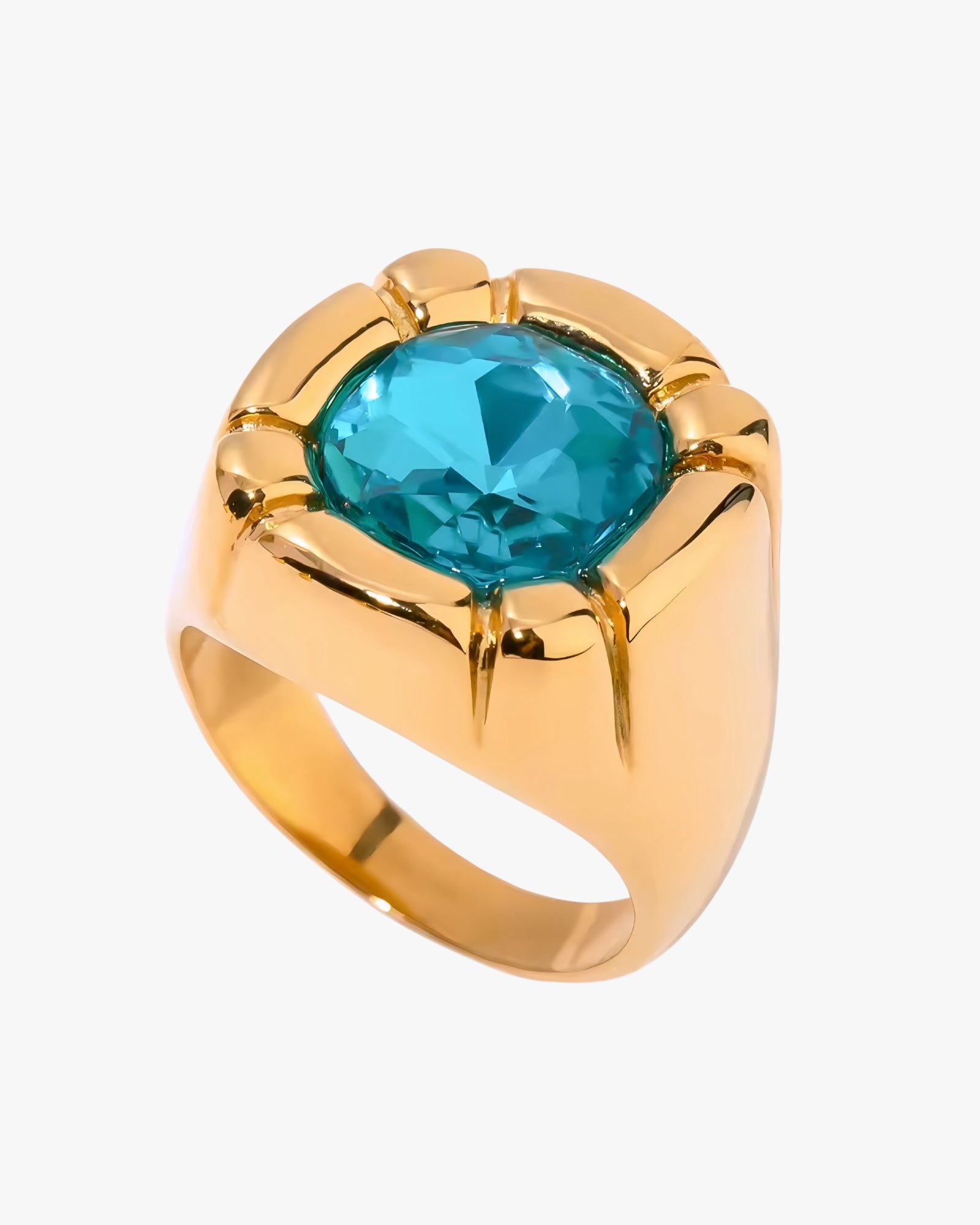 Gold 18K plated stainless steel ring with a blue gemstone on a white background 